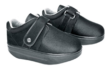 Pair of DARCO Closed-Toe Wound Recovery Shoes with adjustable straps in a sleek black finish.